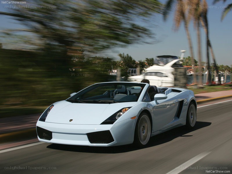 white lamborghini driving on road
