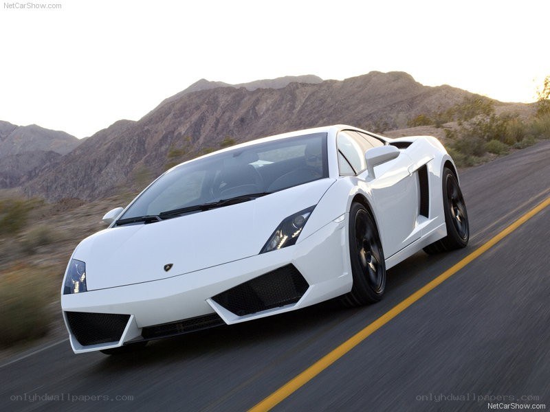 White Lamborghini driving on road