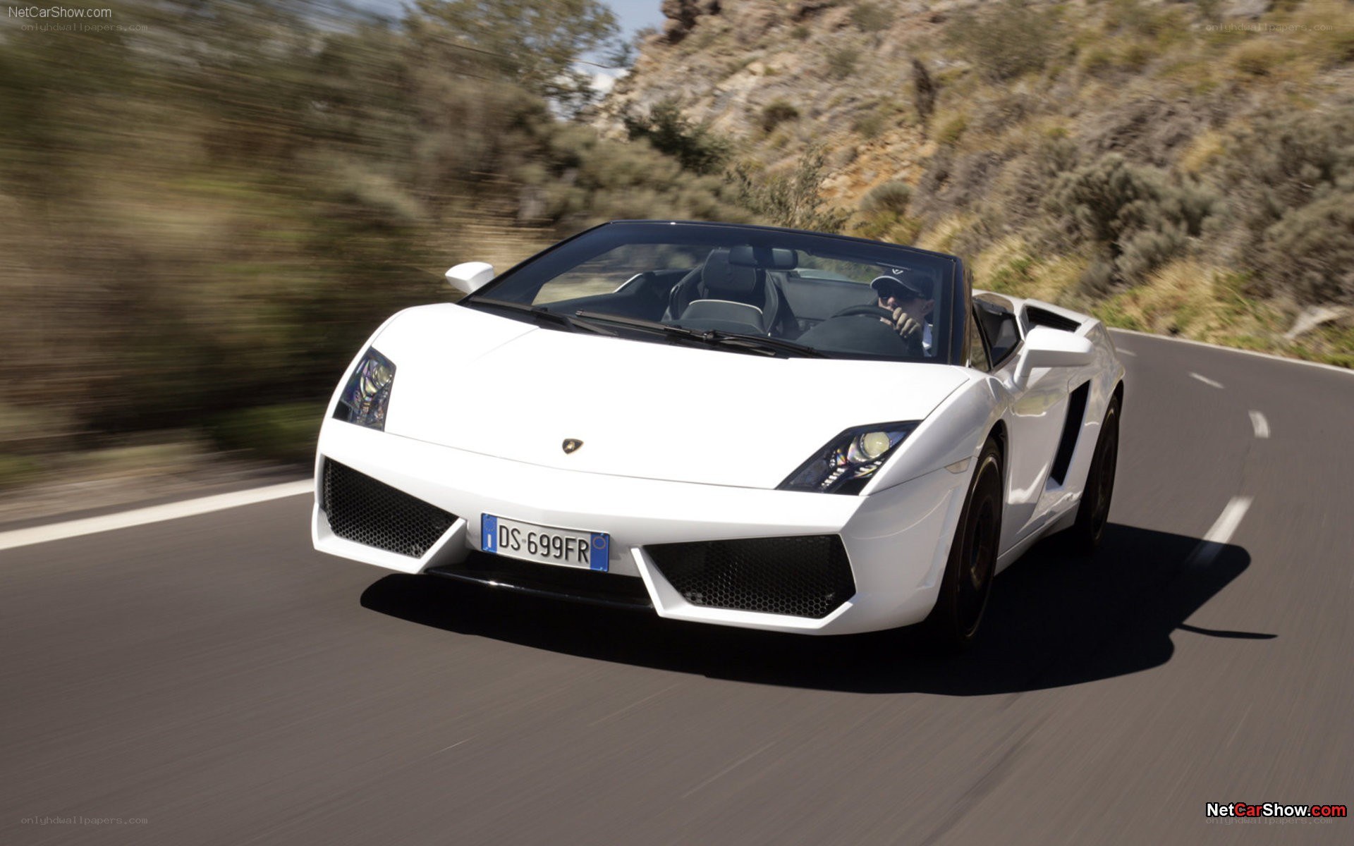 white lamborghini driving on road