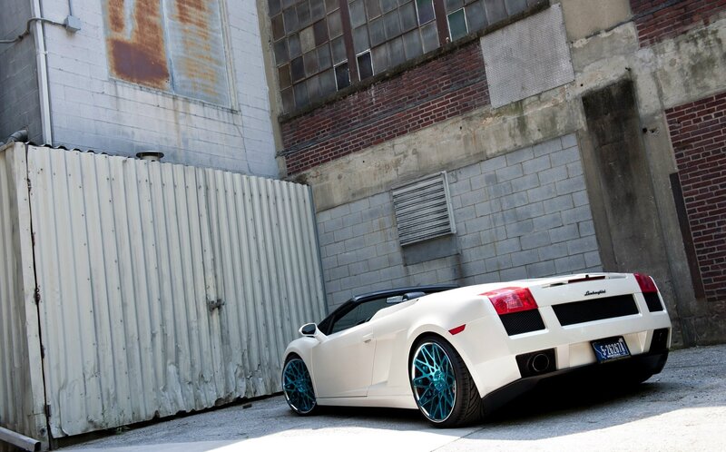 white lamborghini in alley