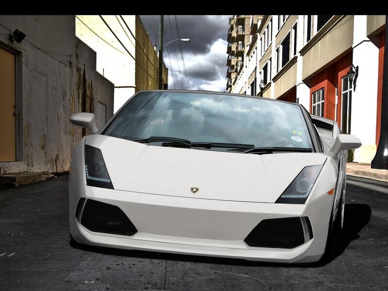 white lamborghini in alley
