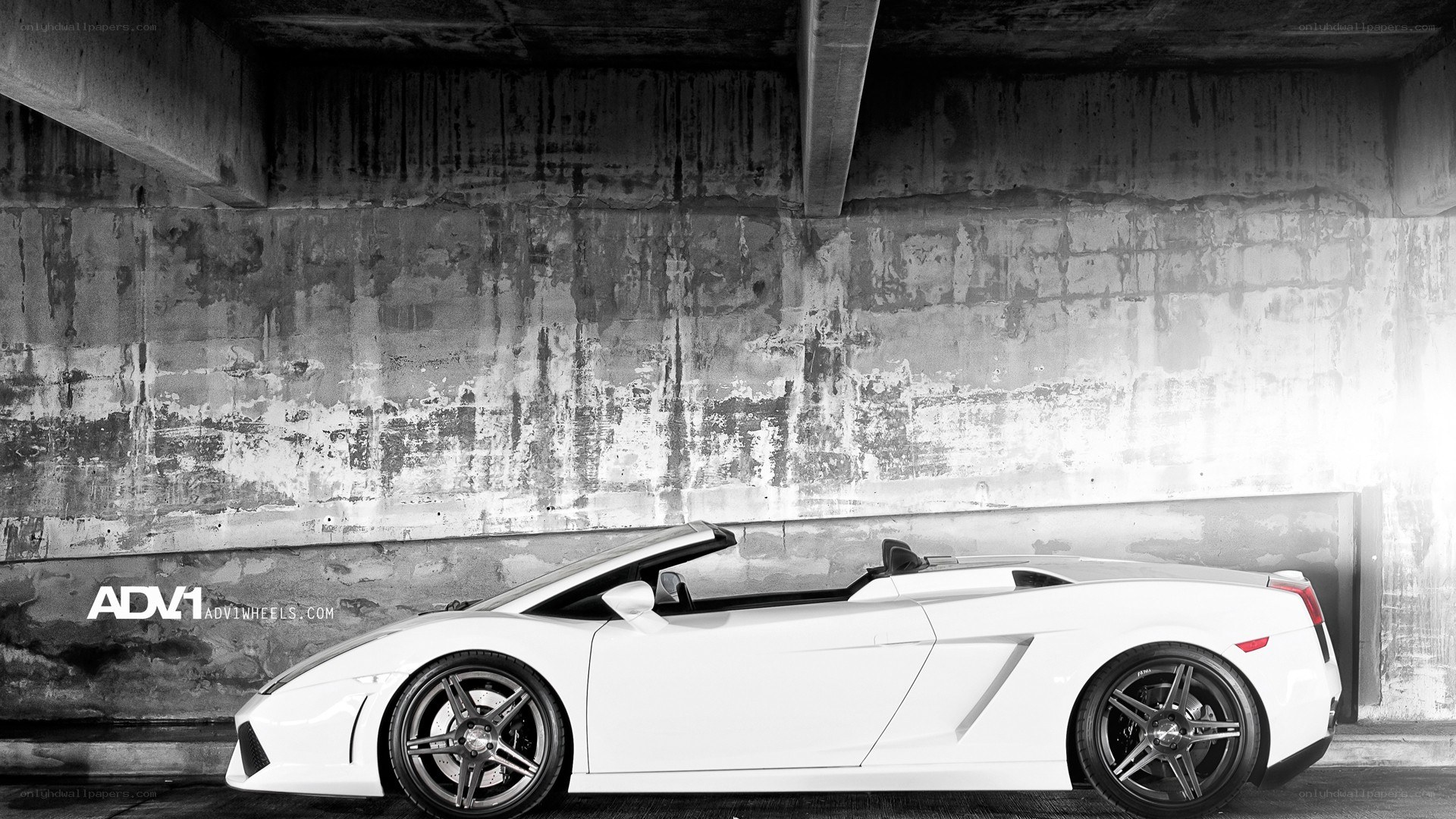 White Lamborghini in concrete garage