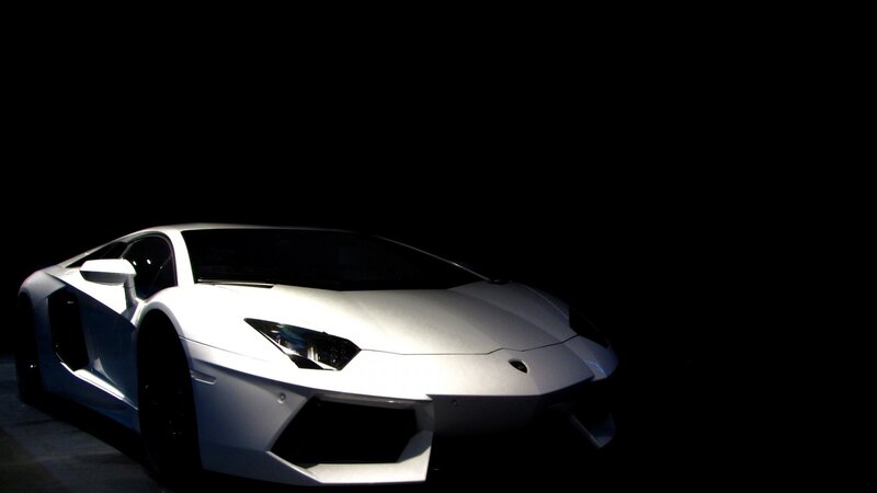 white lamborghini in dark room