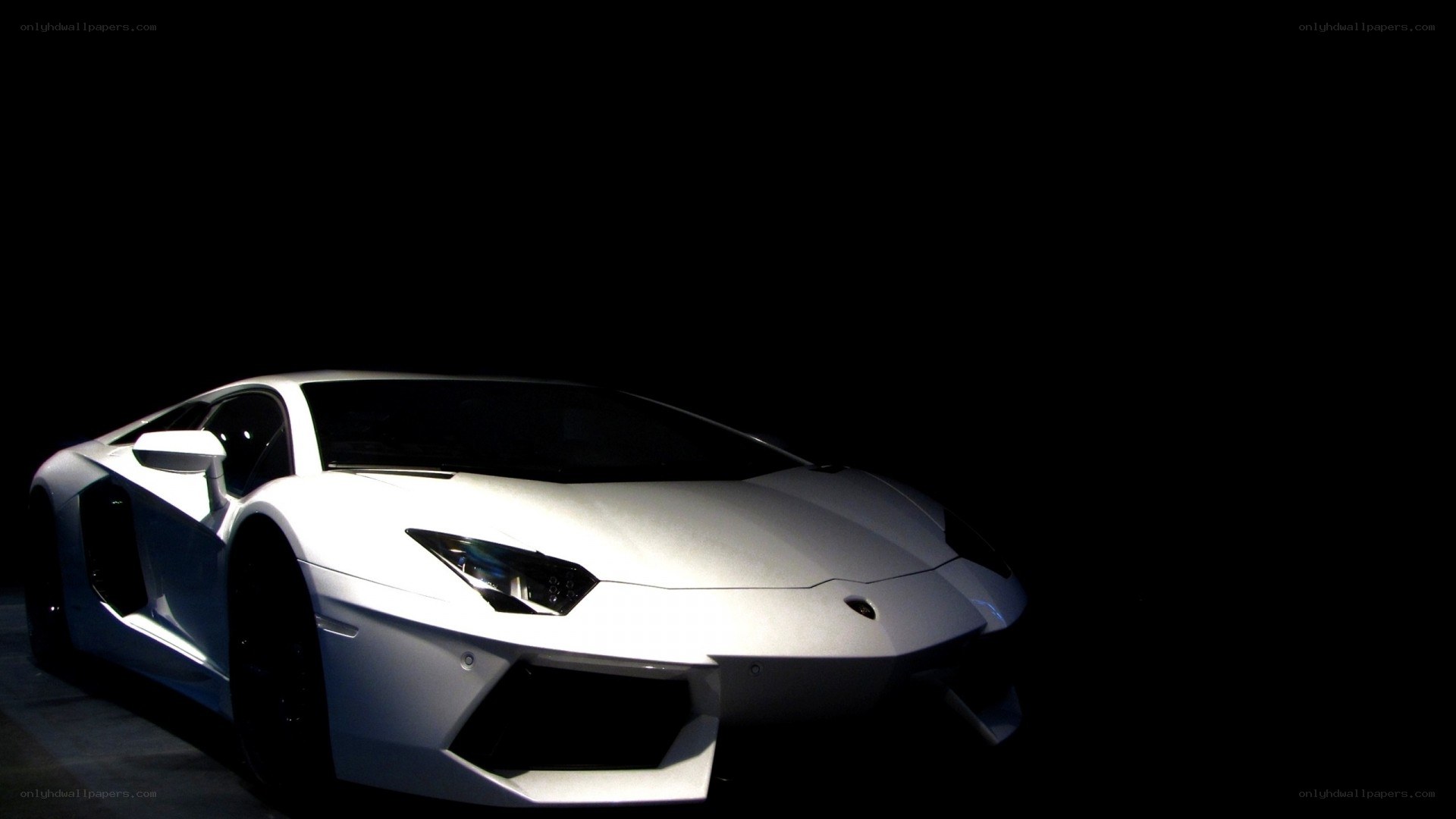 white lamborghini in dark room