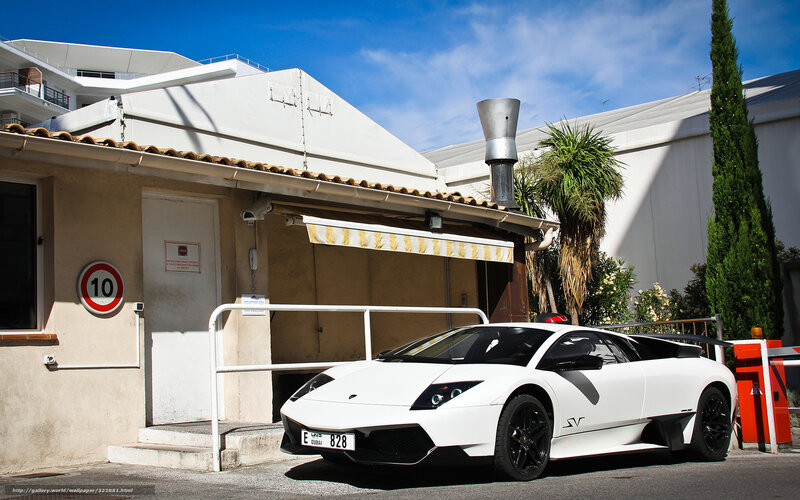 White Lamborghini in front of building