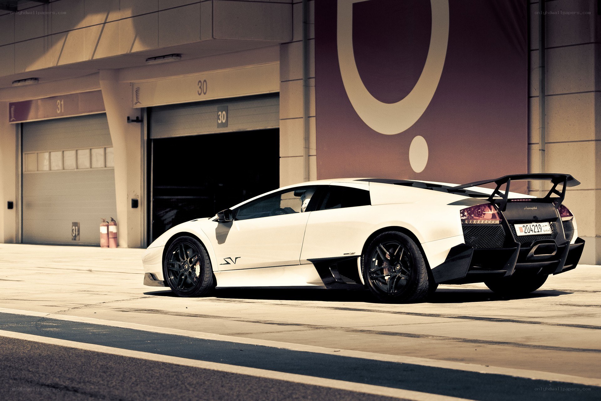 white lamborghini in garage