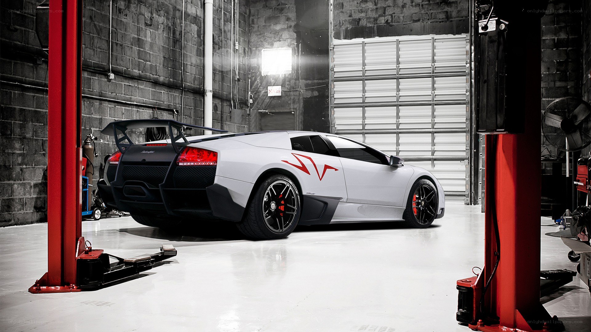 white lamborghini in garage