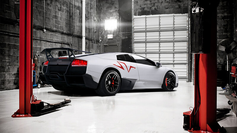White Lamborghini in Garage — Dramatic, Photograph, Car Lift