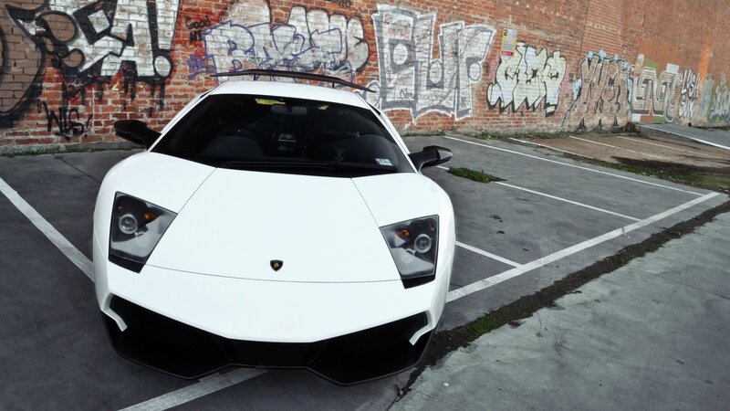White Lamborghini in graffiti parking lot