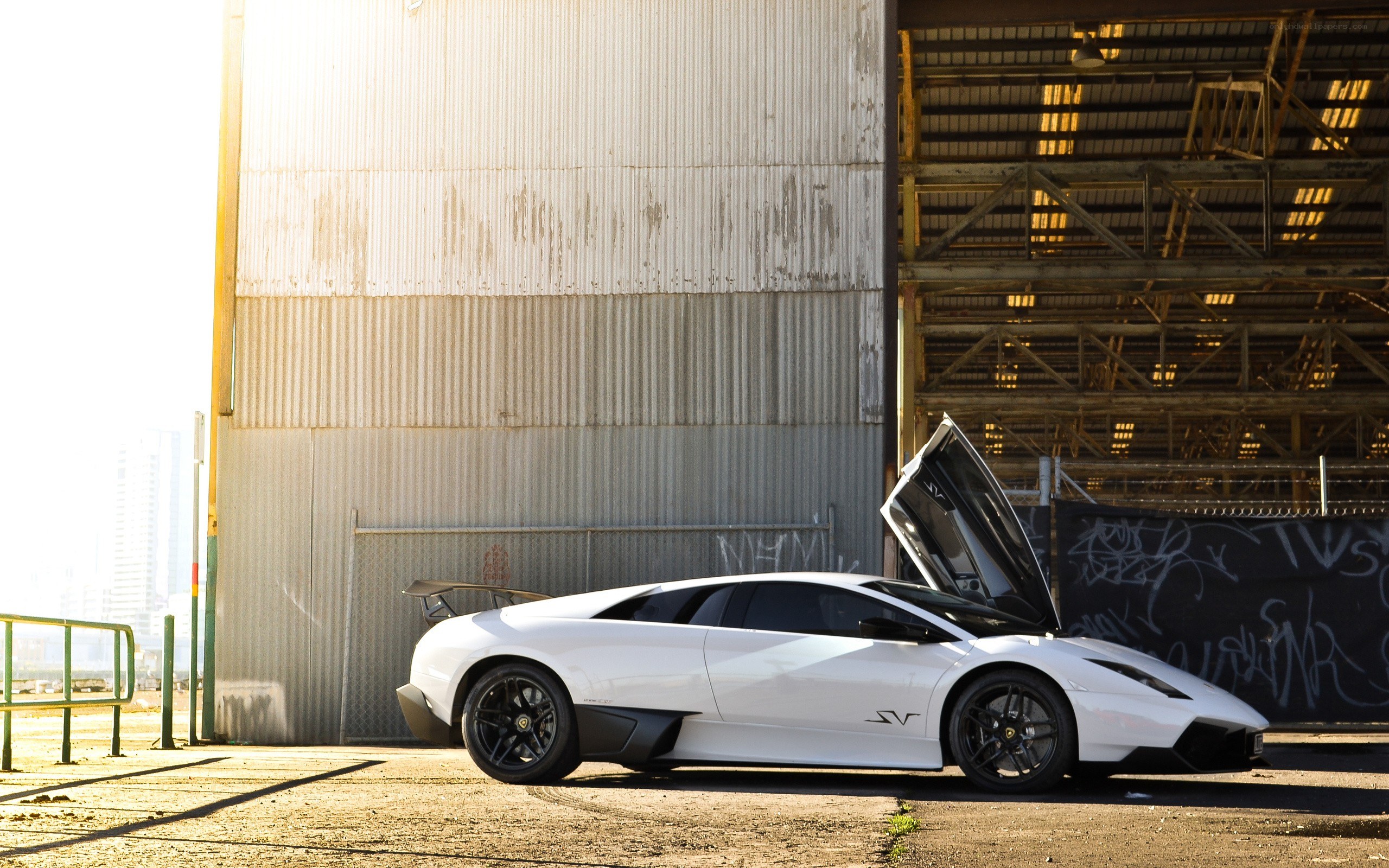 White Lamborghini in industrial setting