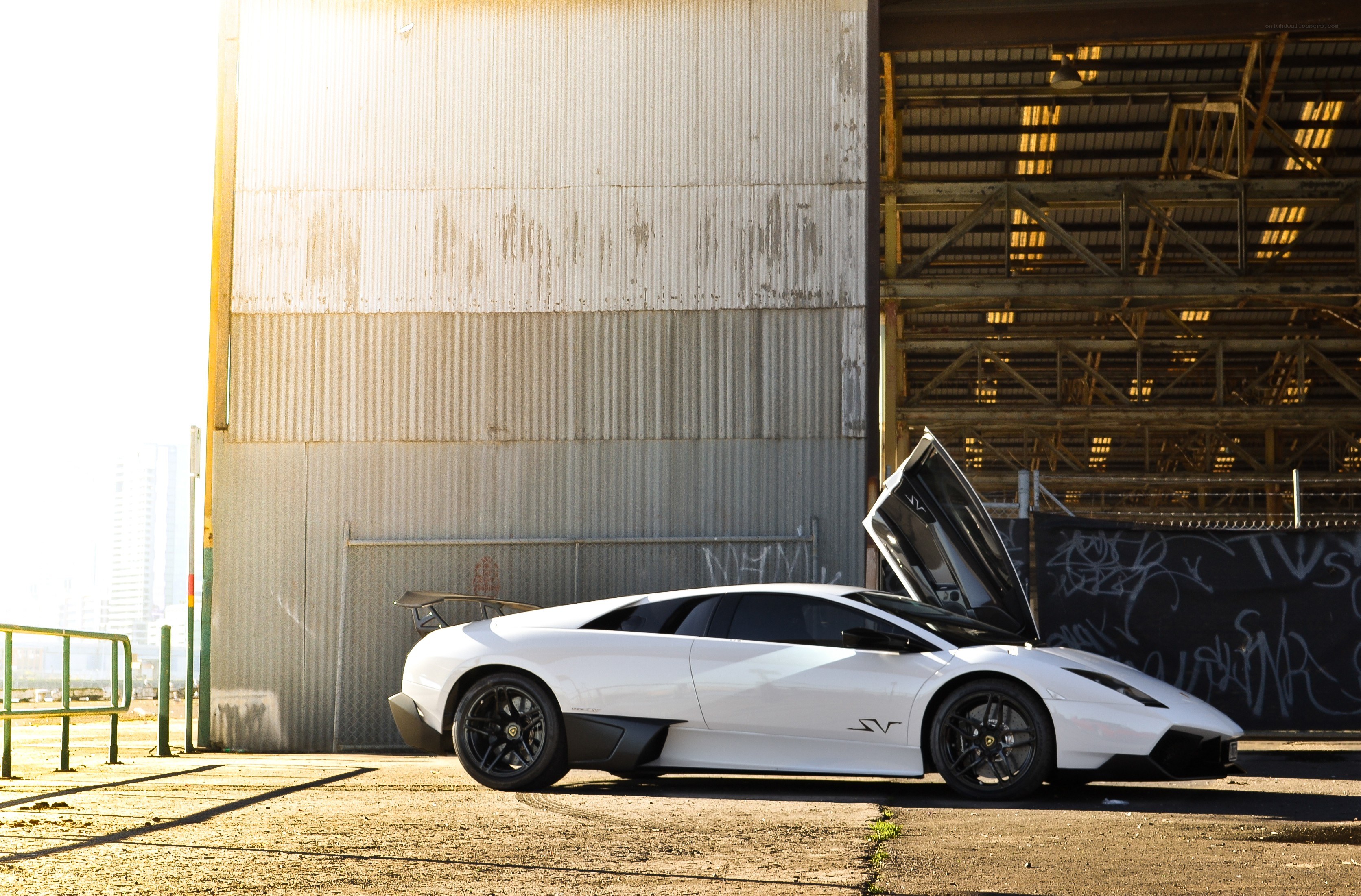 White Lamborghini in industrial setting