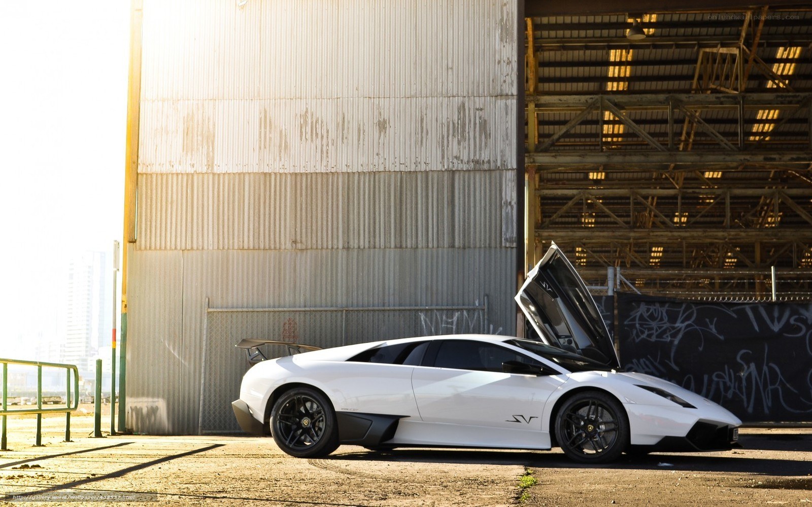 White Lamborghini in industrial setting