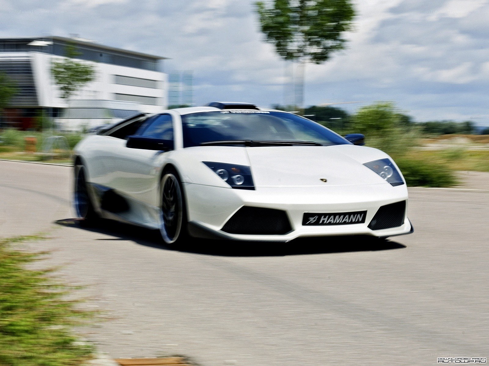 white lamborghini in motion