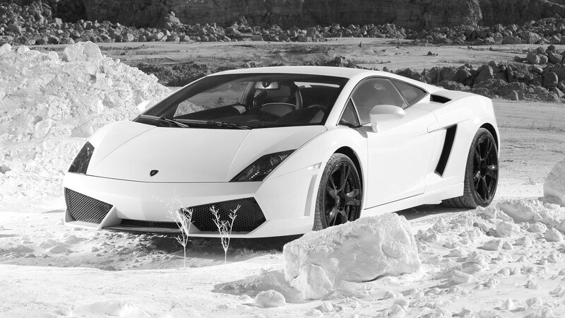 White Lamborghini in snowy landscape