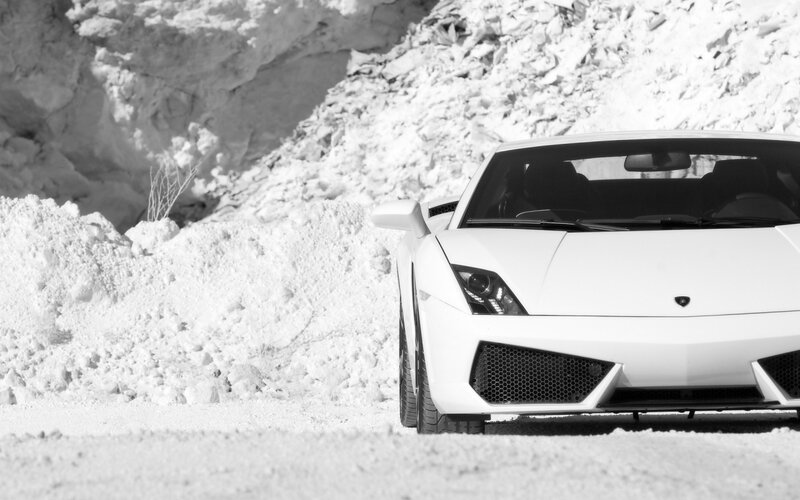 White Lamborghini in snowy landscape