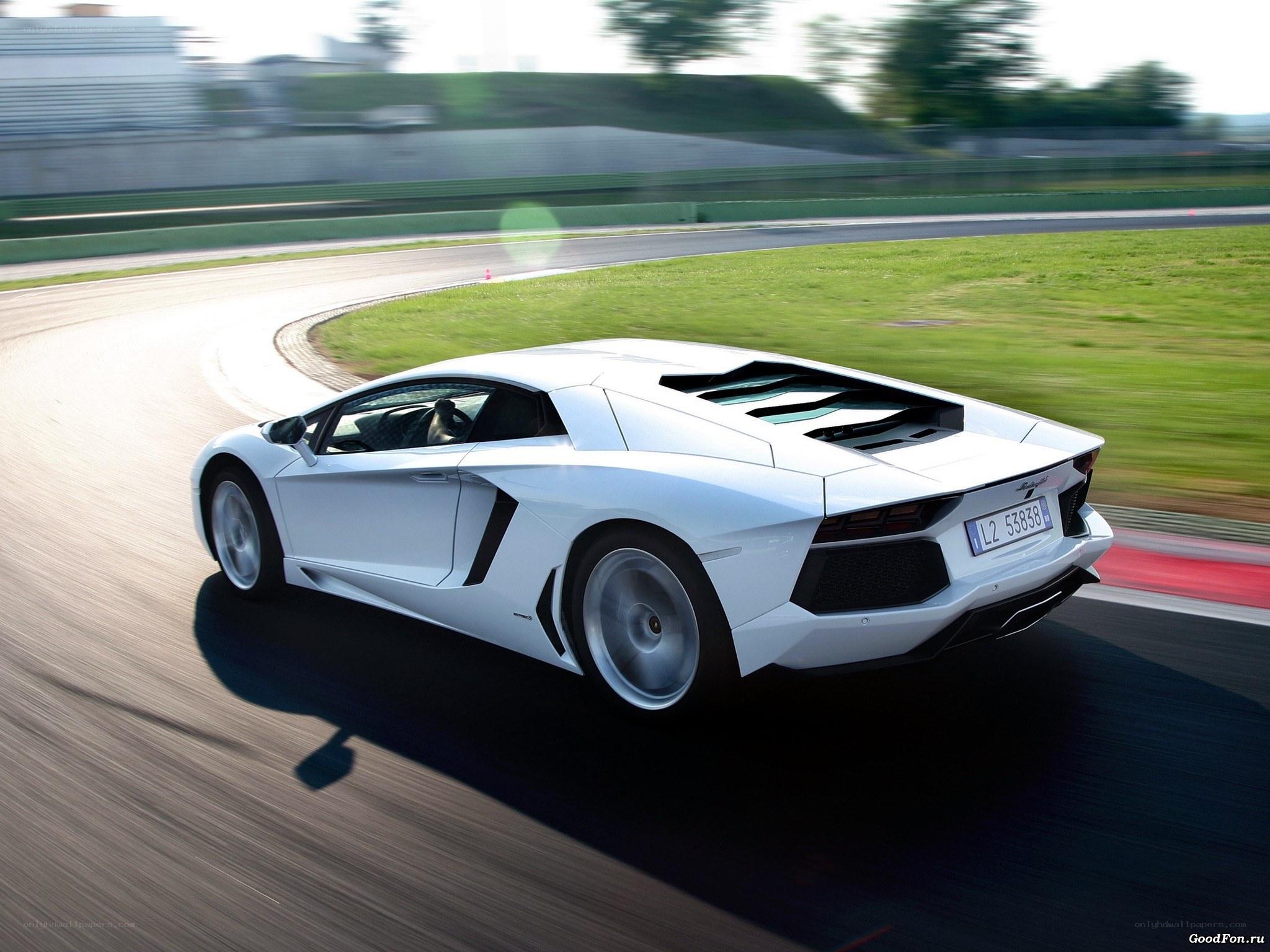 White Lamborghini on a racetrack