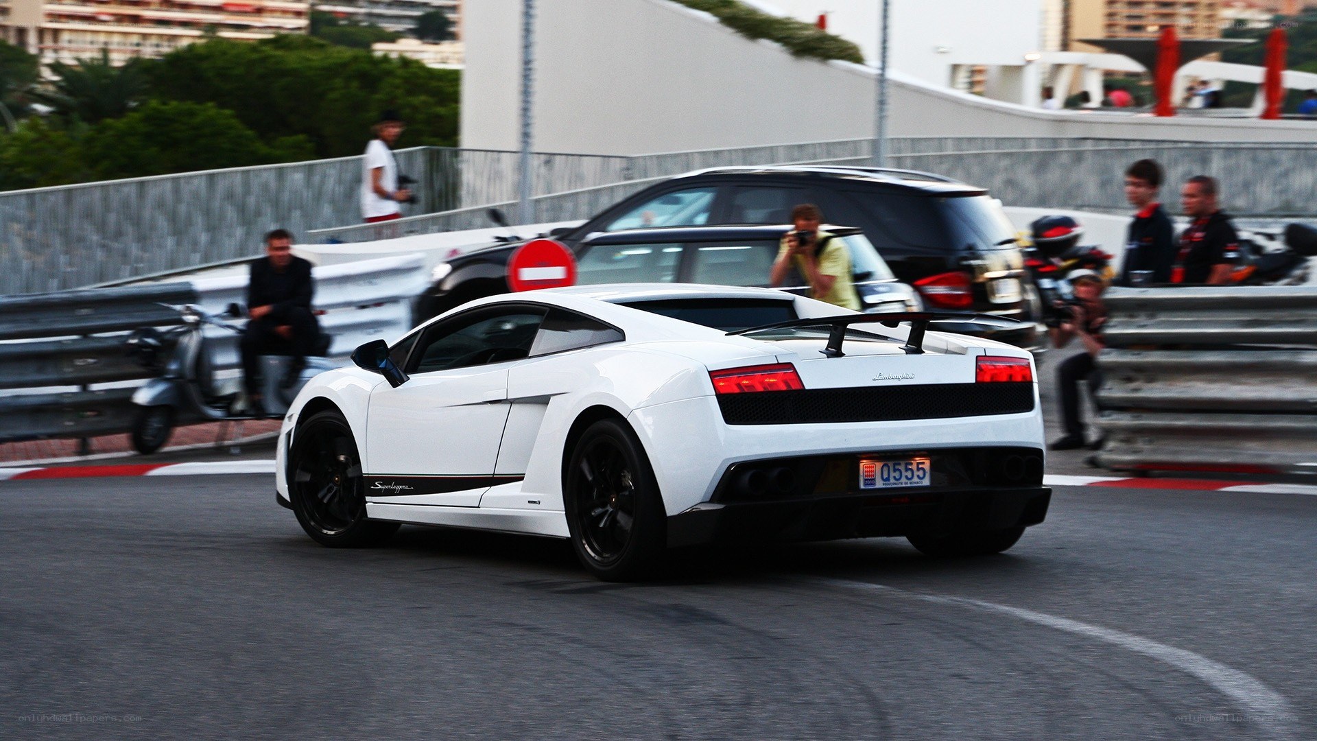 White Lamborghini on a racetrack
