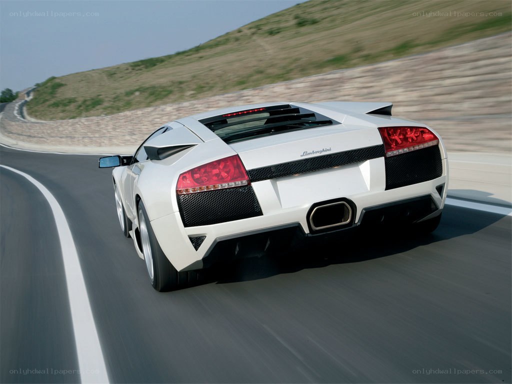 white lamborghini on a racetrack