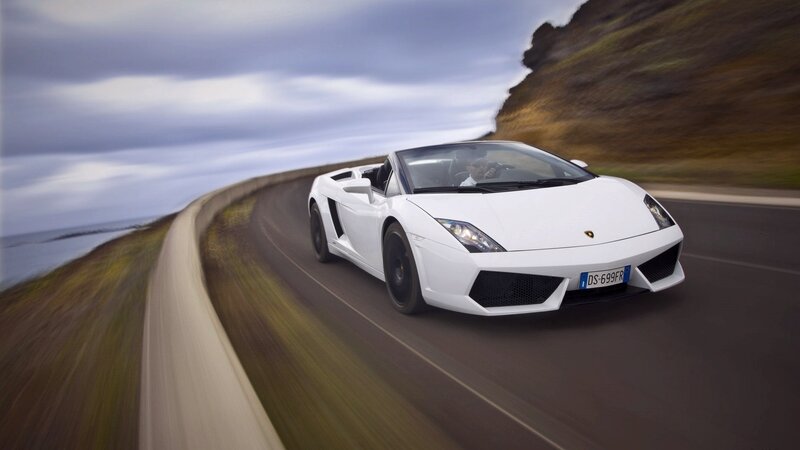 White Lamborghini on coastal road