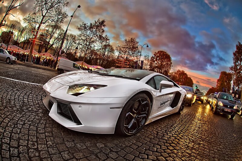 White Lamborghini on cobblestone street