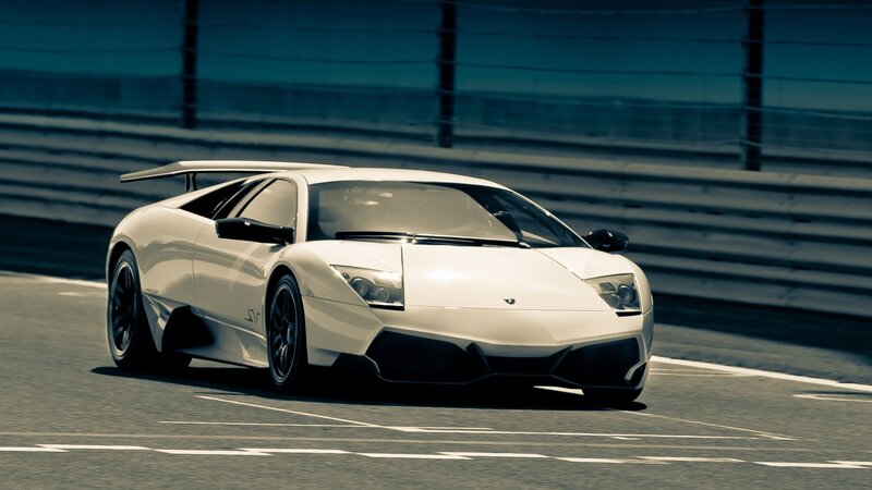 white lamborghini on racetrack