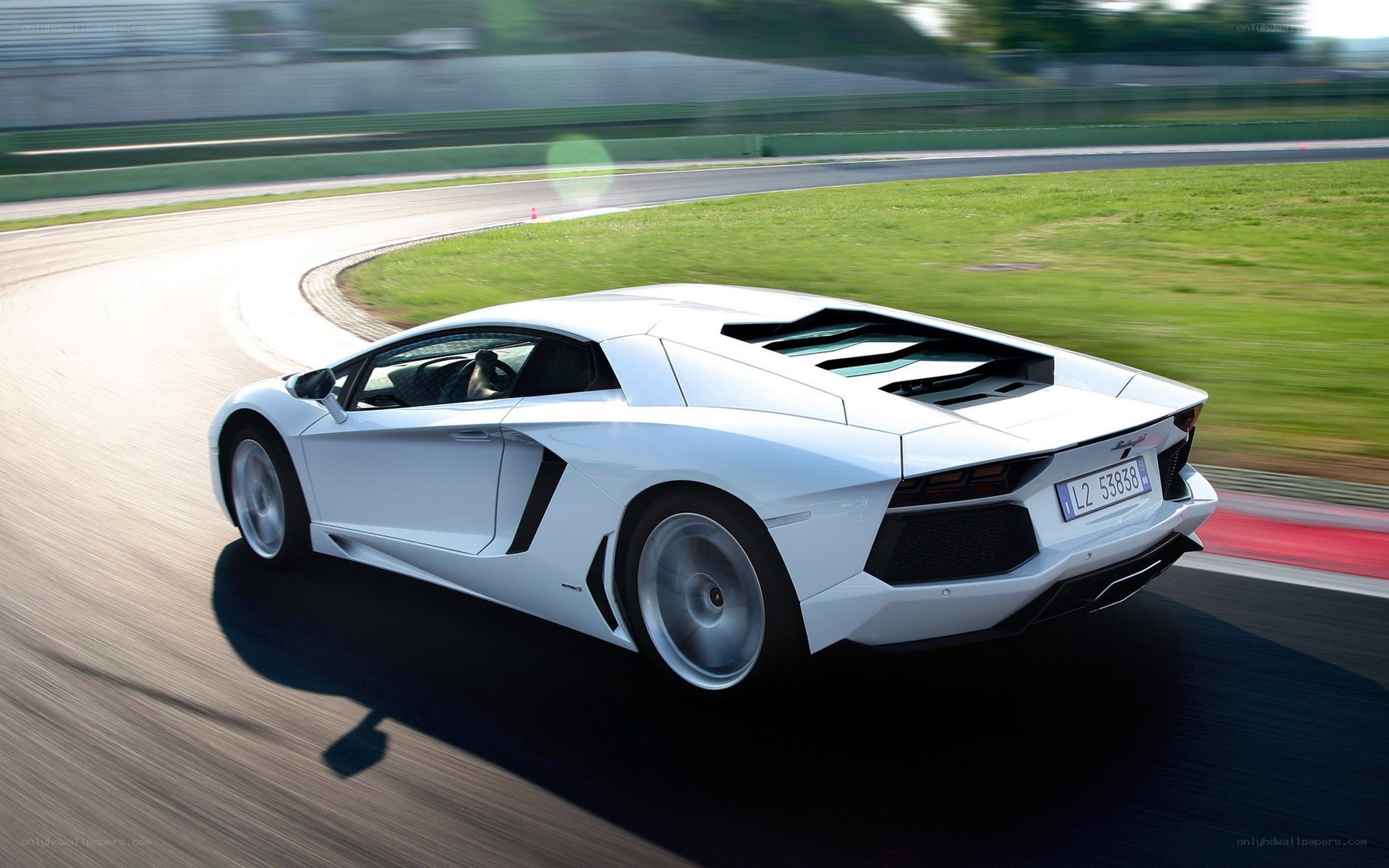 White Lamborghini on racetrack