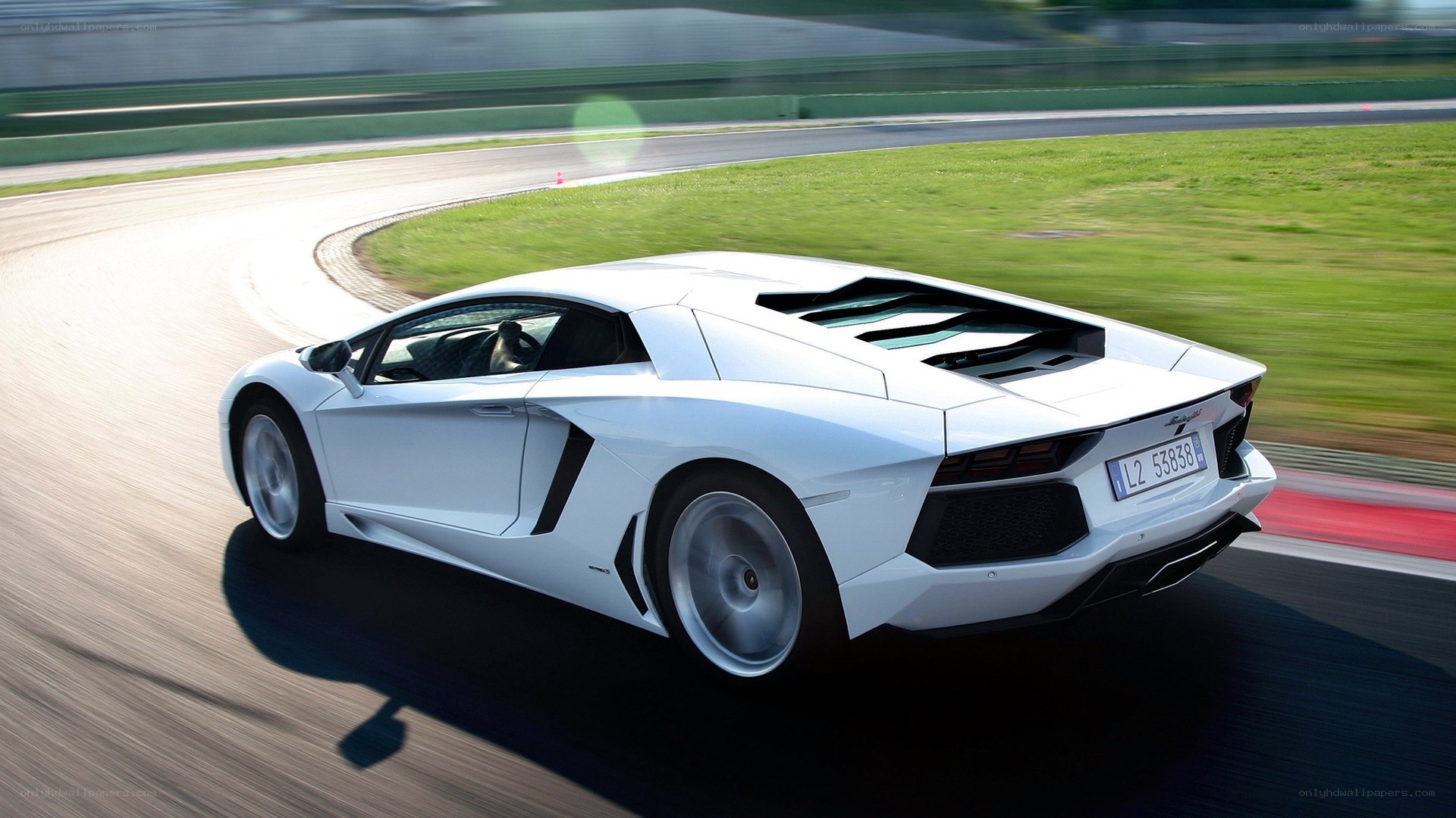 White Lamborghini on racetrack