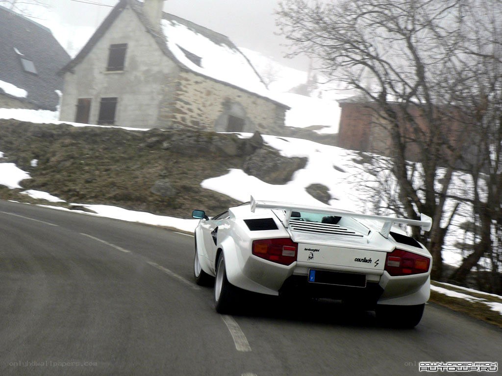 White Lamborghini on snowy road