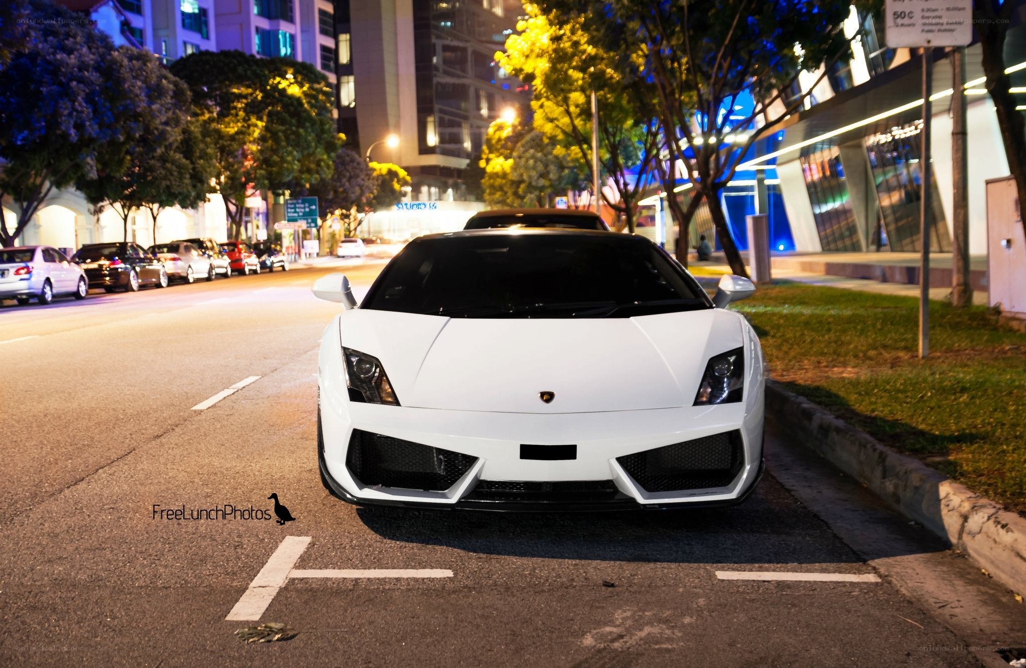 White Lamborghini parked at night