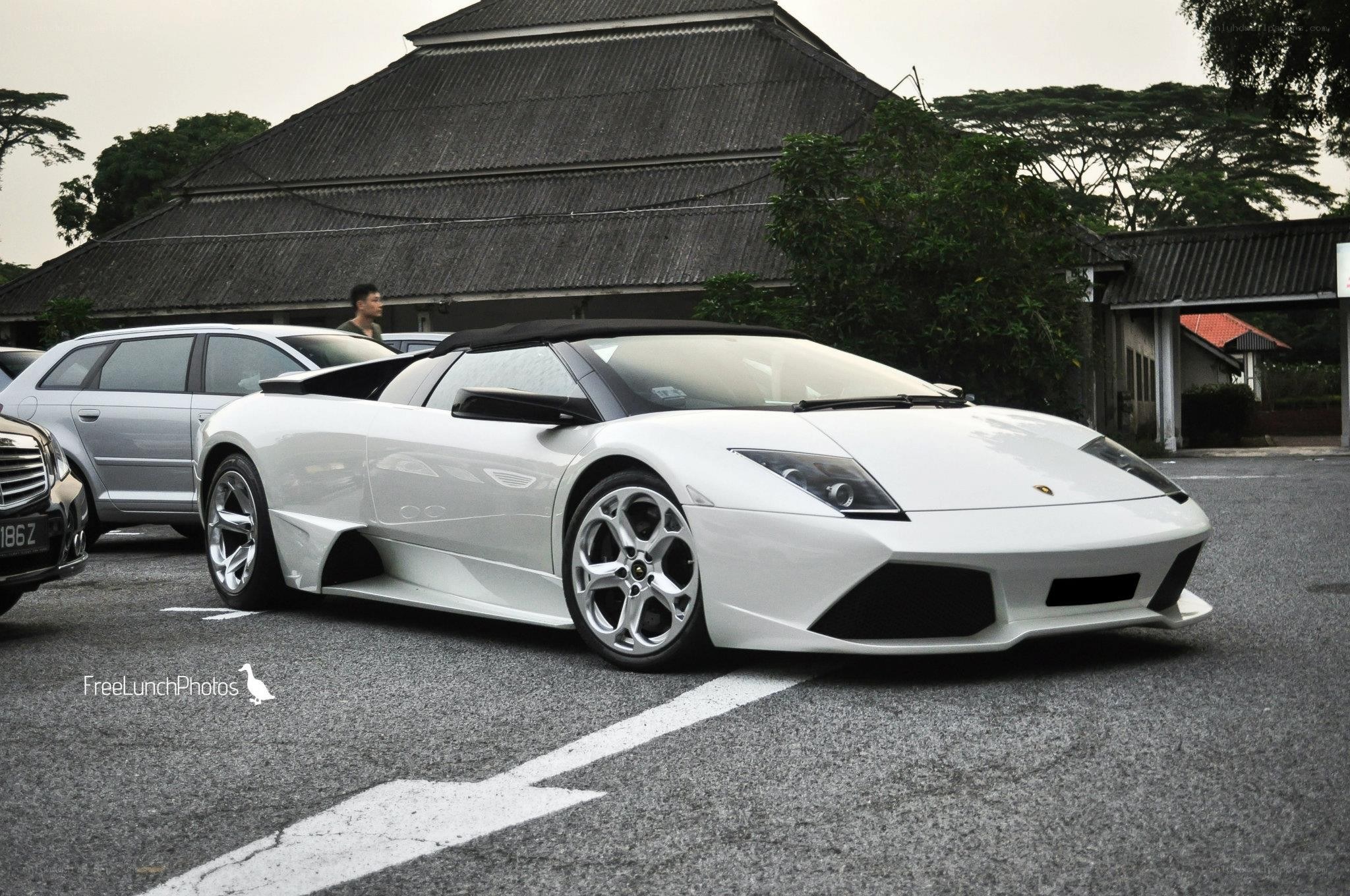 White Lamborghini parked in lot