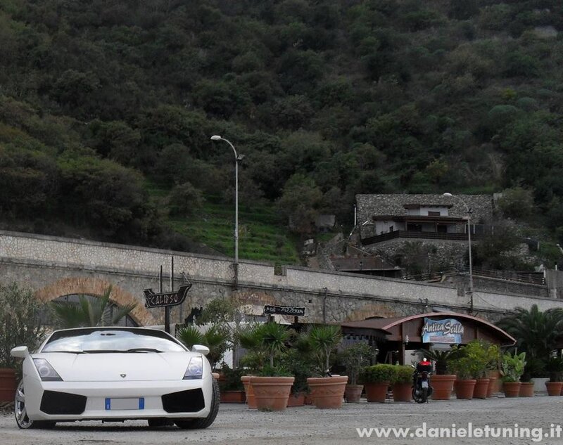 white lamborghini parked near restaurant