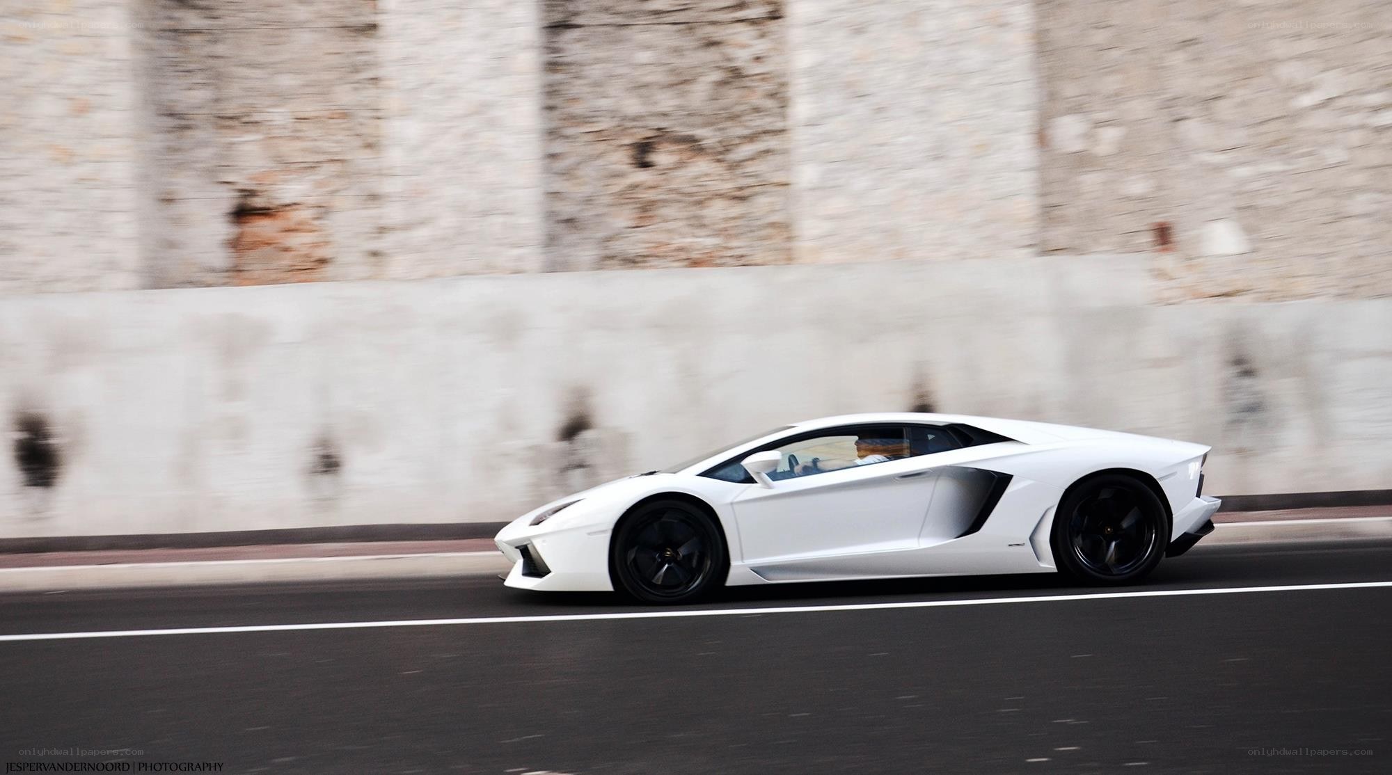 White Lamborghini speeding on road