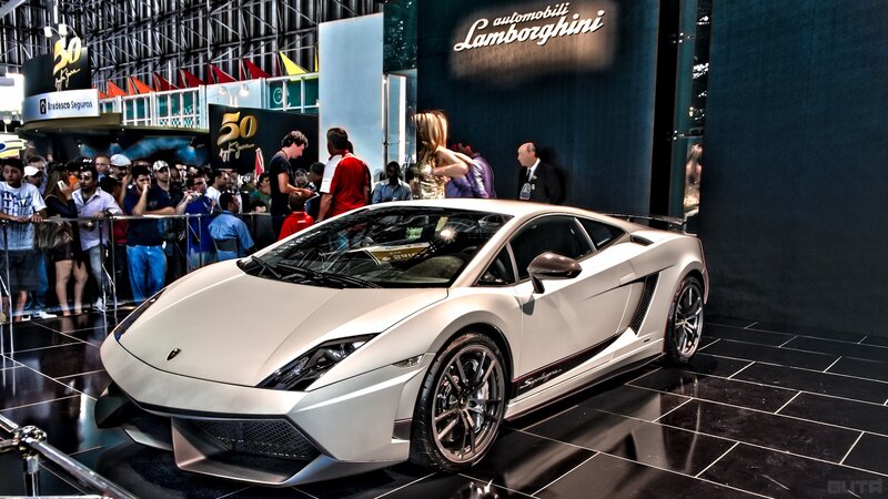White Lamborghini Sports Car — Dramatic, Photograph, Crowd