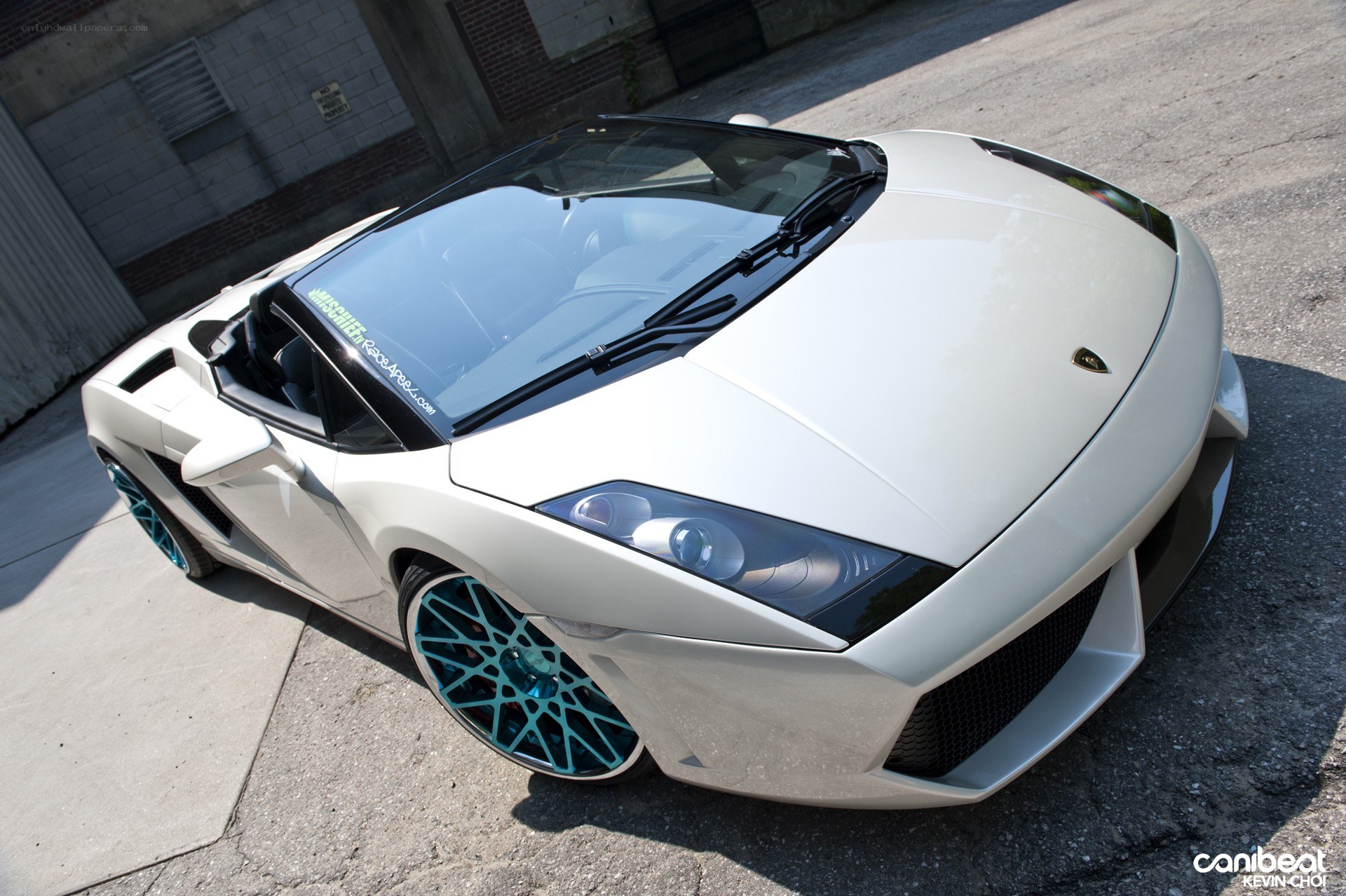 white lamborghini with blue wheels