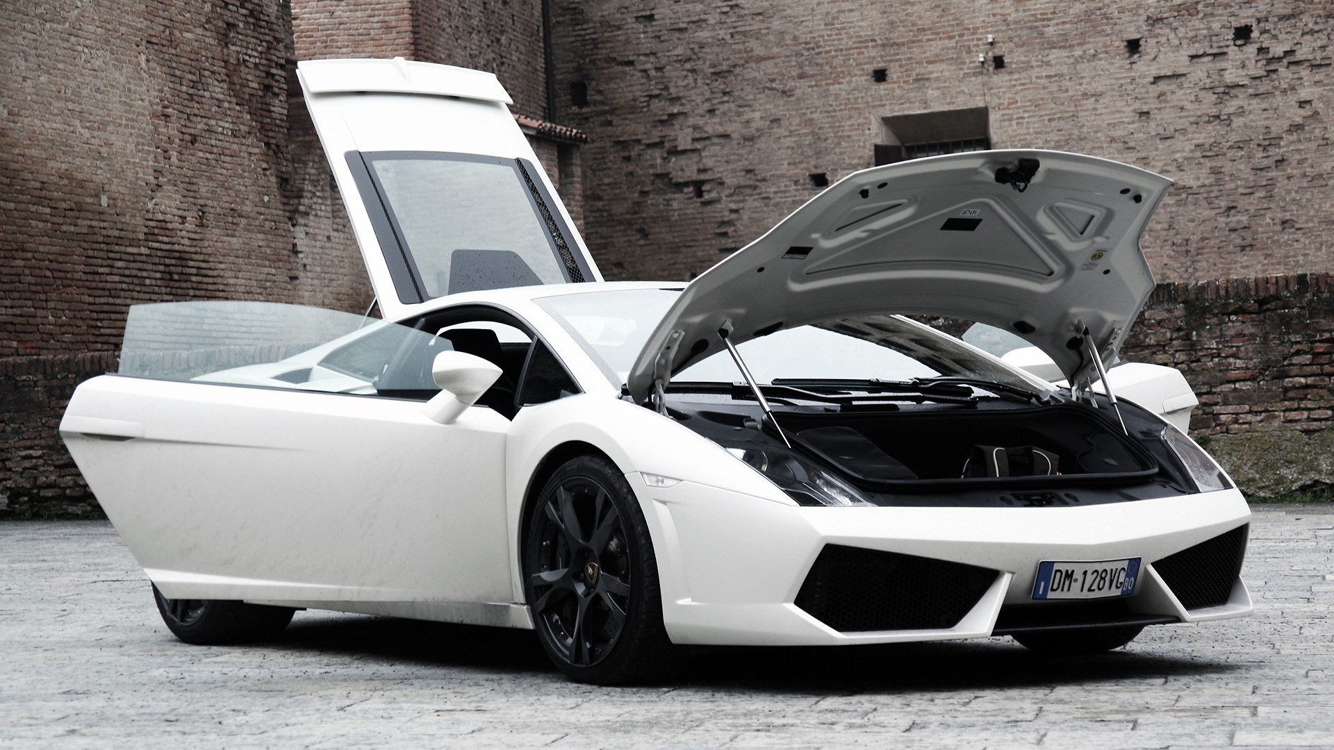 White Lamborghini with doors open