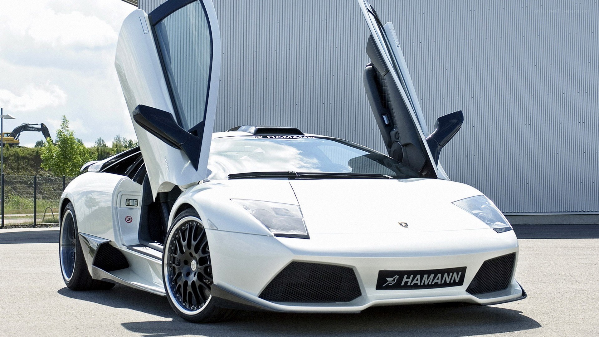 White Lamborghini with doors open