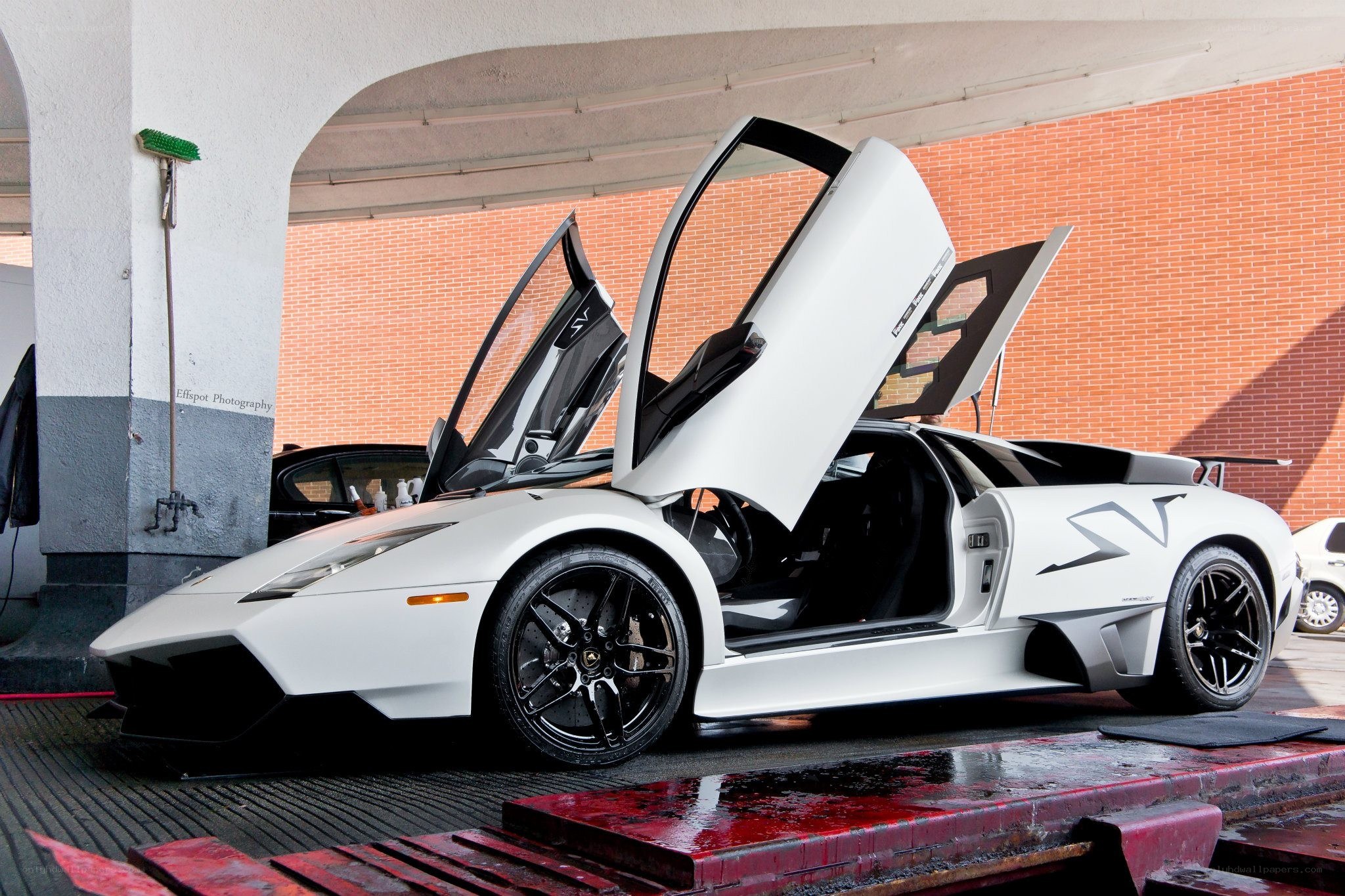 White Lamborghini with doors open