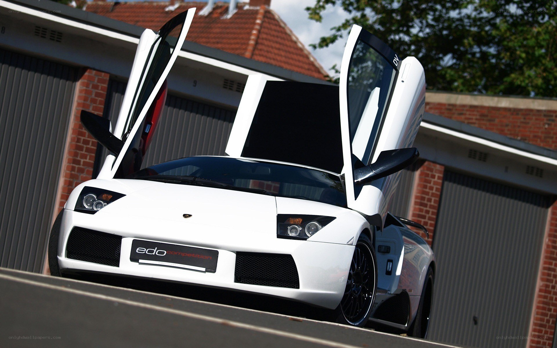 White Lamborghini with doors open