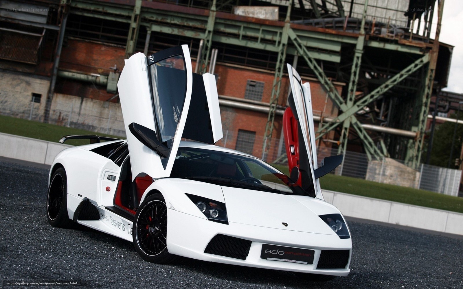 White Lamborghini with doors open