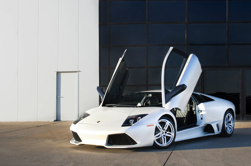 White Lamborghini with doors open