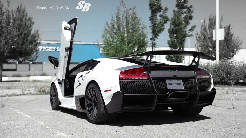 white lamborghini with open door