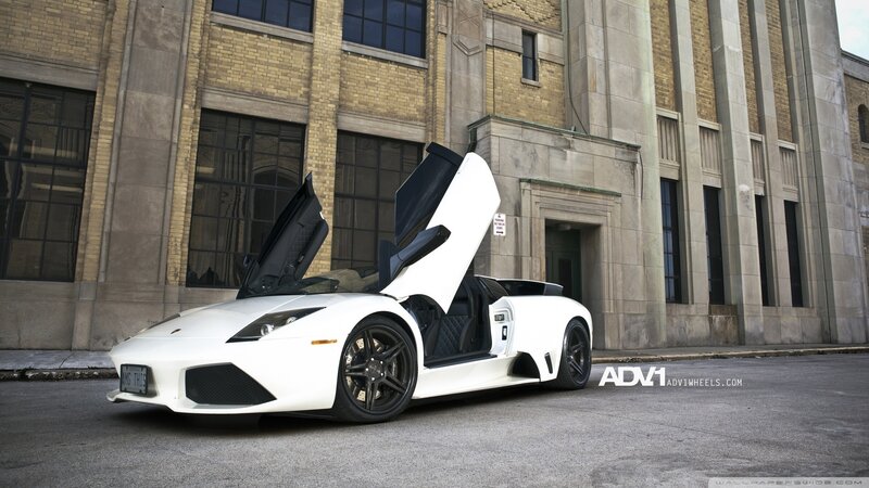 white lamborghini with open doors