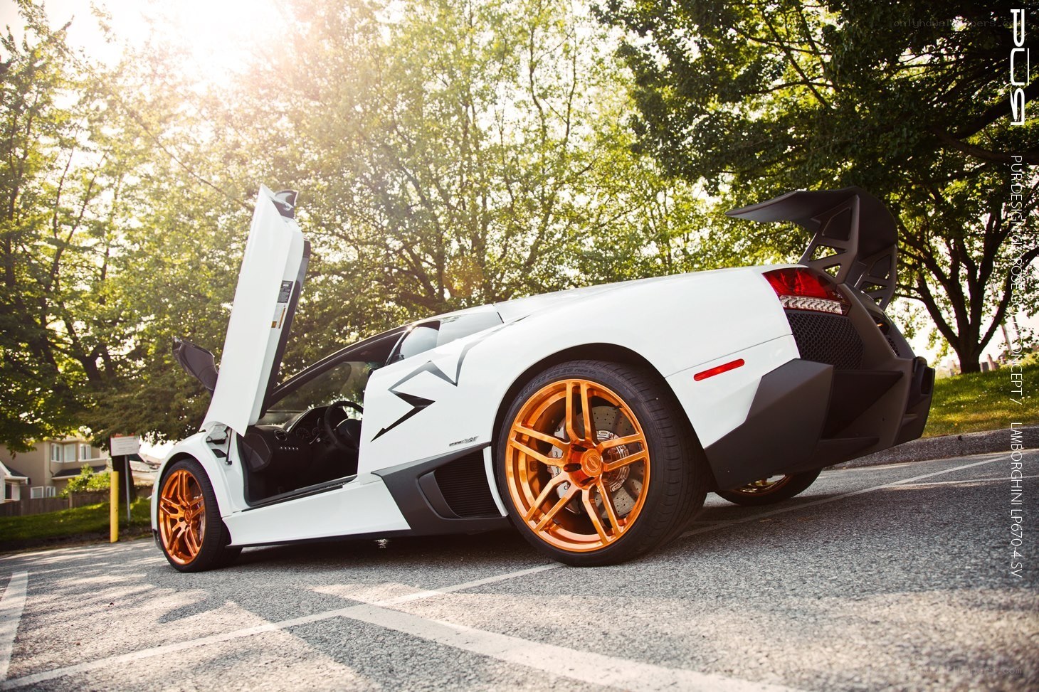 white lamborghini with orange wheels