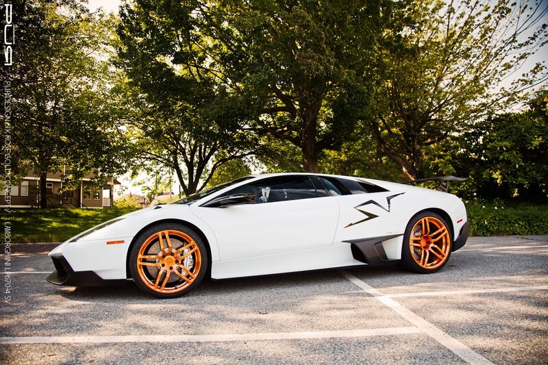 white lamborghini with orange wheels