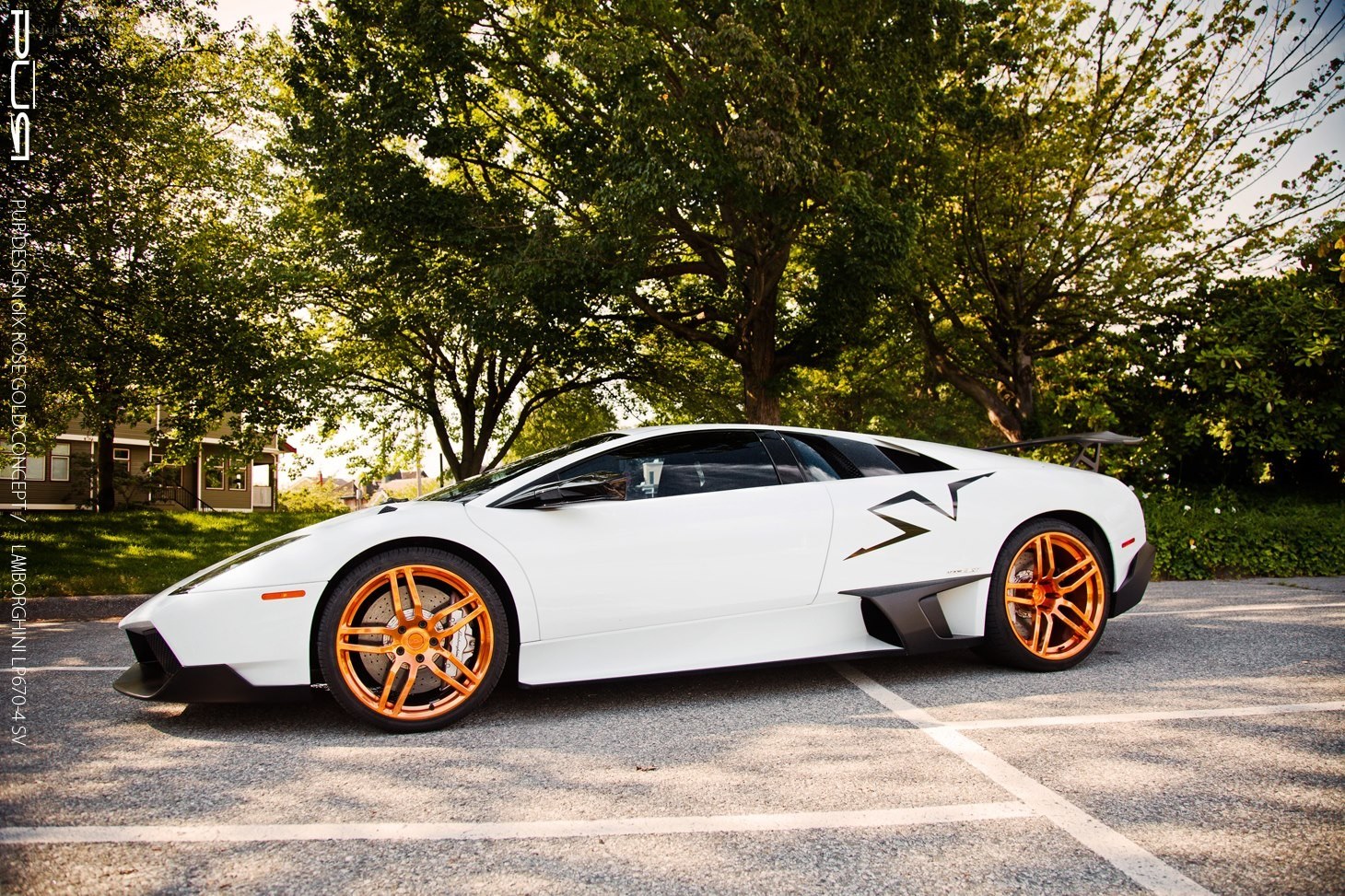 white lamborghini with orange wheels