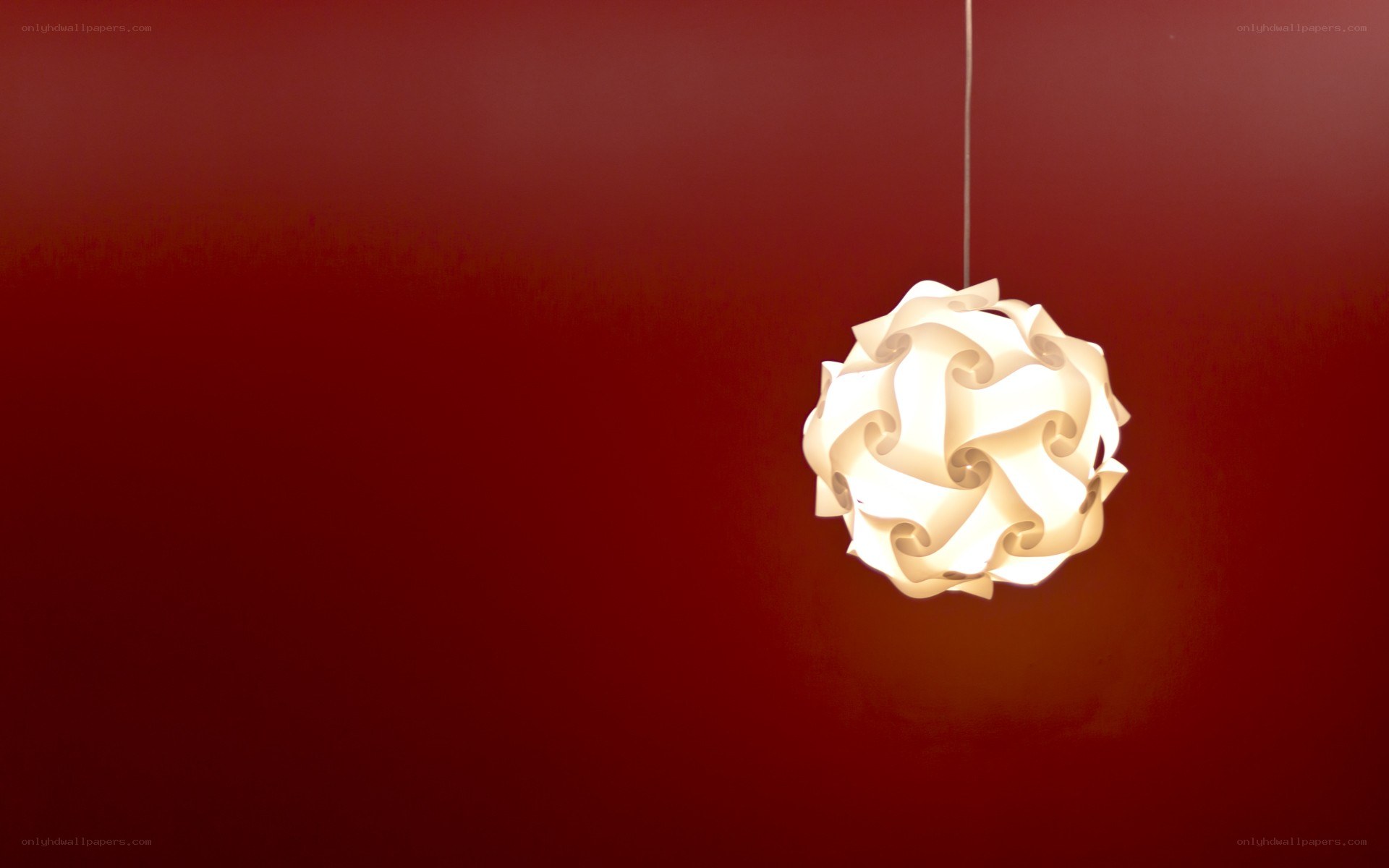 white lampshade against red wall