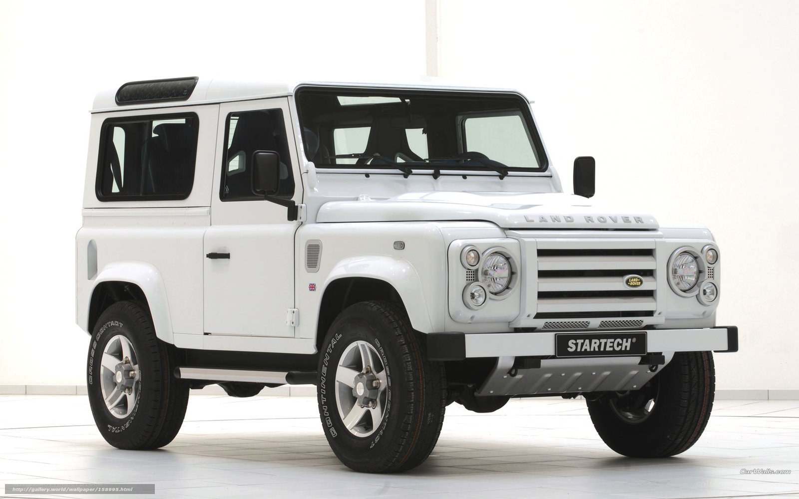 white land rover defender