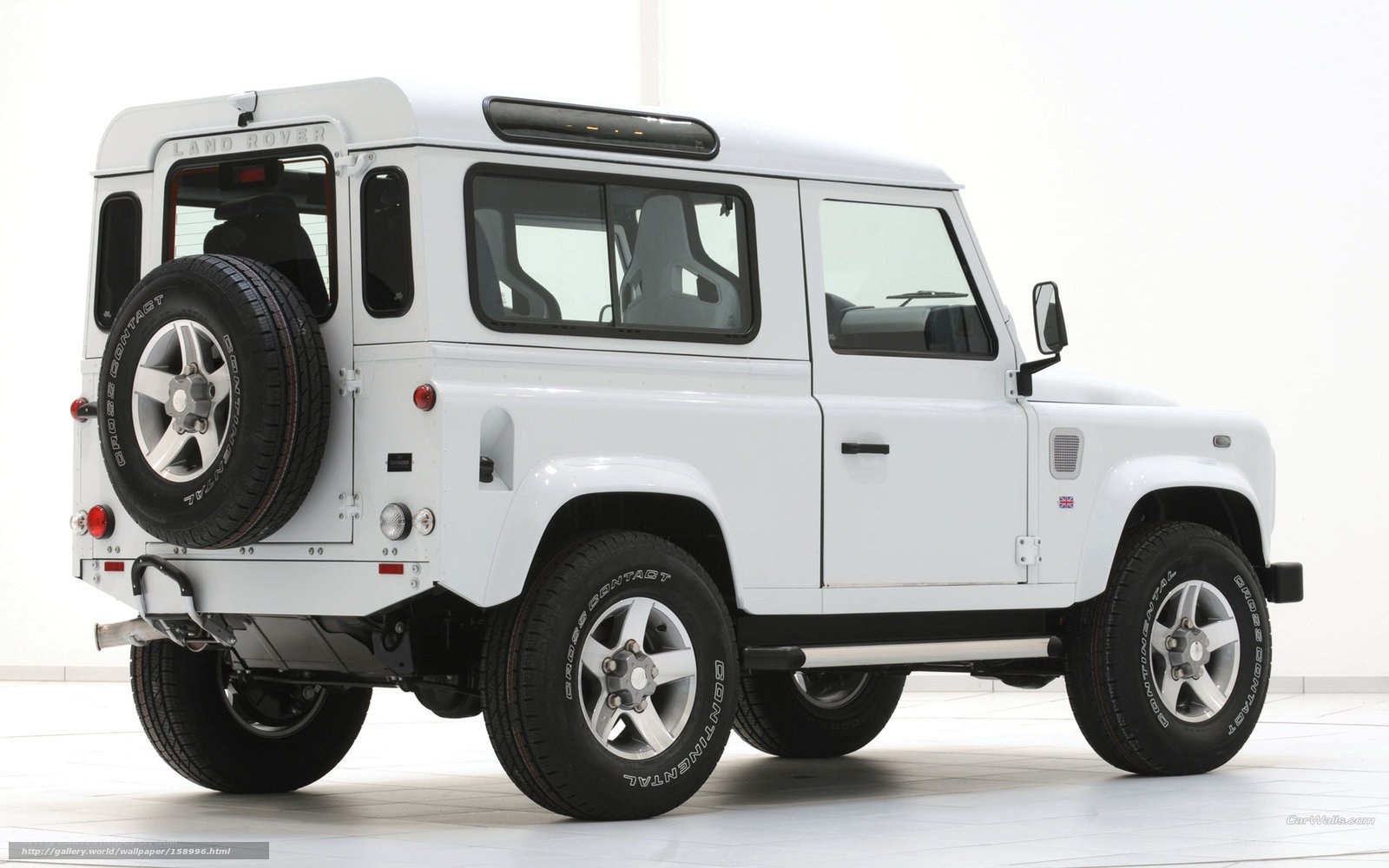 white land rover defender