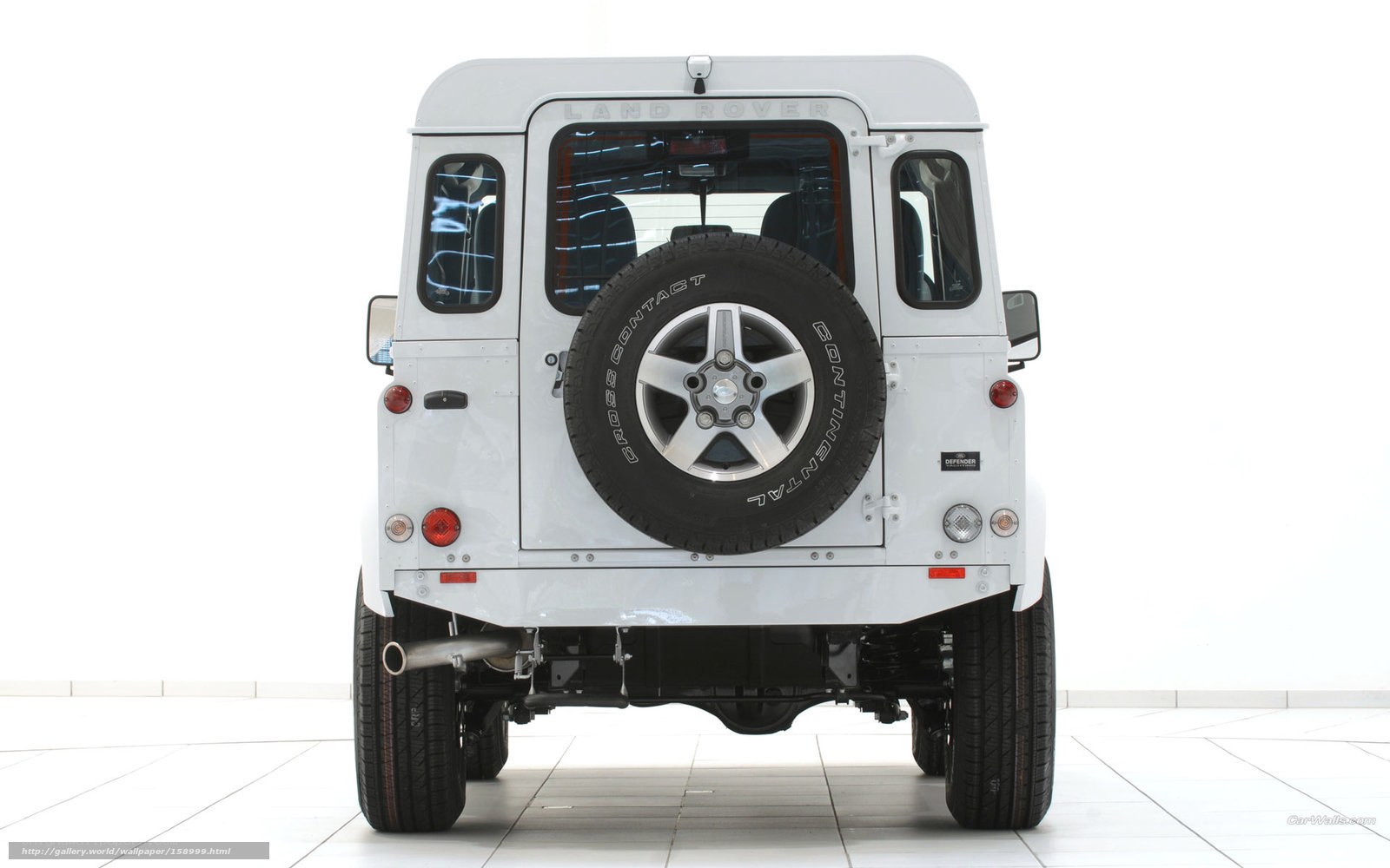 white land rover defender