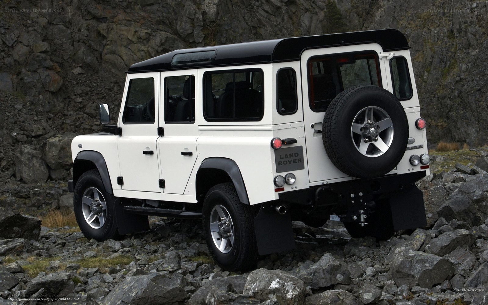 white land rover defender
